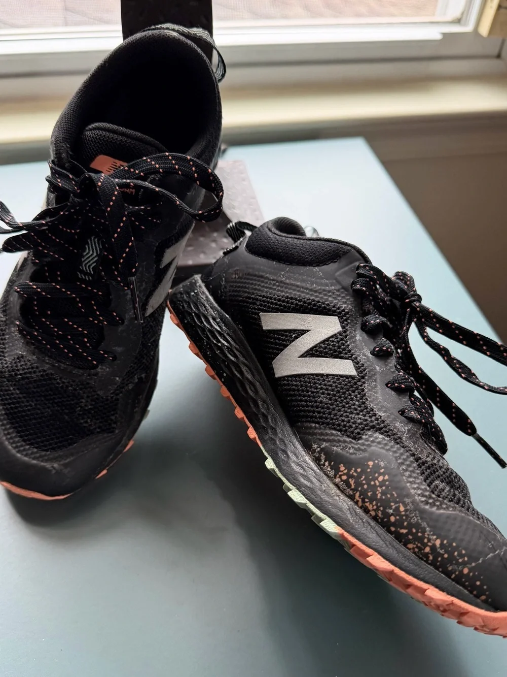 New Balance Kids Black Sneakers with orange/teal Accent